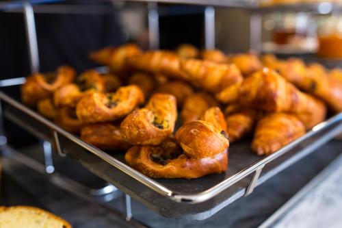 a bunch of pretzels sitting on a tray at Etoile de Pompadour in Arnac-Pompadour