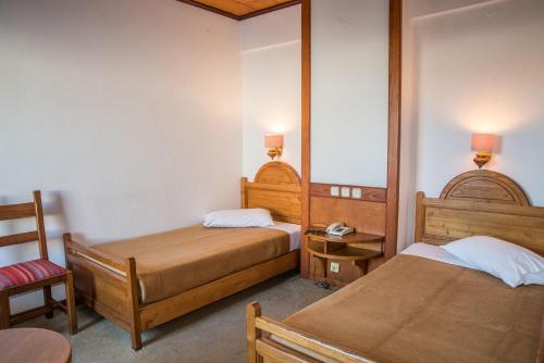 Ένα ή περισσότερα κρεβάτια σε δωμάτιο στο Hotel Galini Patmos