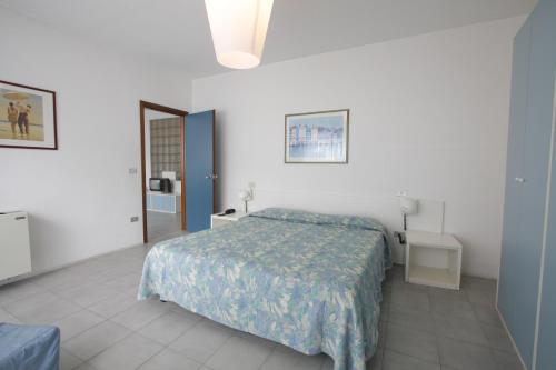Postel nebo postele na pokoji v ubytování Grand Hotel Golf