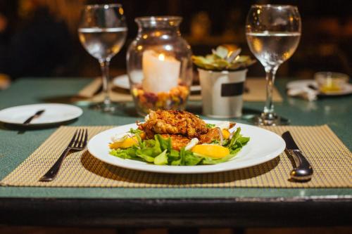 a plate of food on a table with a plate of food at Barradas Parque Hotel & Spa in Punta del Este