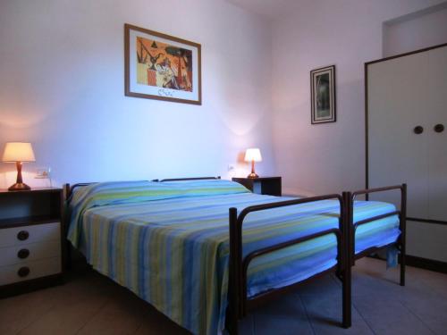 a bedroom with a bed and a dresser and a mirror at Ammiraglio in Campese