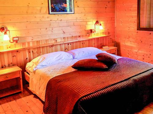 a bedroom with a bed with two pillows on it at Albergo Genzianella in Careggine