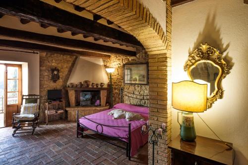 Ένα ή περισσότερα κρεβάτια σε δωμάτιο στο Borgo alle Mura