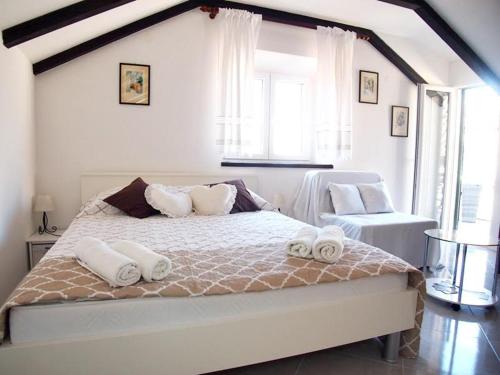 Postel nebo postele na pokoji v ubytování Rooms & Studio Stipcic