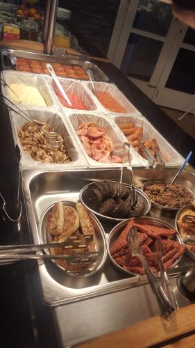 a buffet with a lot of different types of food at Queens Plaza Hotel in Blackpool