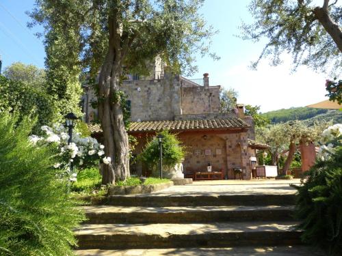 a large stone building with stairs in front of it at Villa Carolina Sorrento Private Heated Pool and Sea View in Sorrento