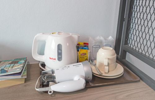 a coffee maker on a tray on a table at Lada Krabi Express in Krabi town