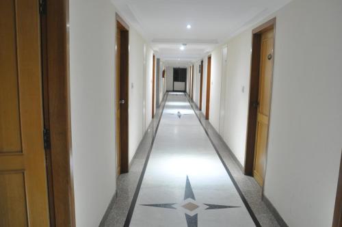 a hallway with a star on the floor of a building at Darling Residency in Vellore