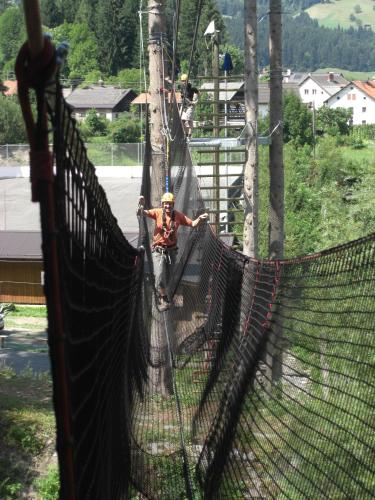 a man on a zip line over a net at Troadkasten in Kötschach