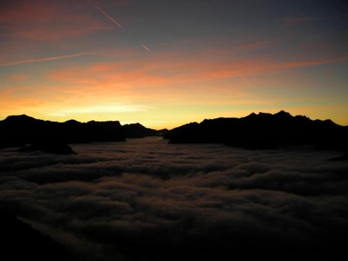 a view of the sunset from above the clouds at Troadkasten in Kötschach