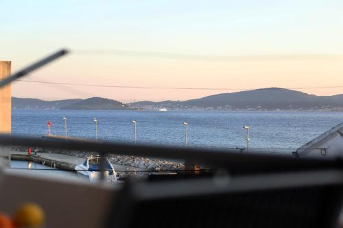 a view of the ocean from a window of a ship at Sunset Apartment in Zadar