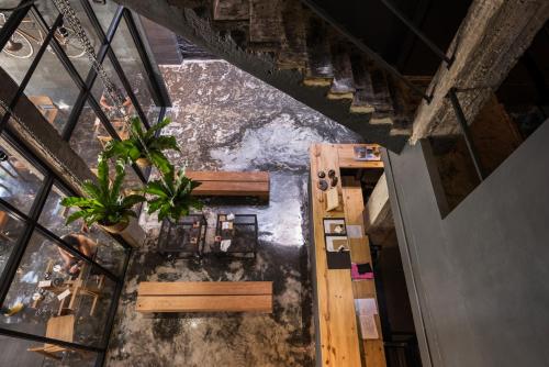 an overhead view of a dining room with a plant at La Pause Hatyai in Hat Yai