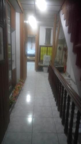 a hallway of a building with a staircase and a room at Art Taiwan Homestay in Shunan