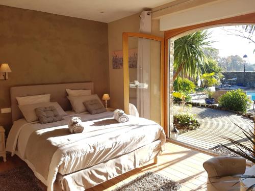 Postel nebo postele na pokoji v ubytování B&B Lou Mas