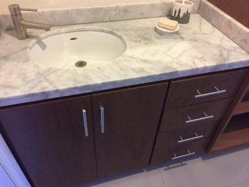 a bathroom vanity with a sink and a counter at Playa a pie Zona Dorada in Mazatlán