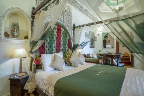 Säng eller sängar i ett rum på Riad Anabel
