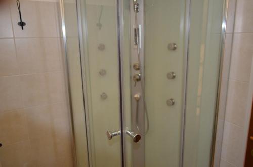 a pair of closet doors in a bathroom at B&B Il Vicoletto in LʼAquila
