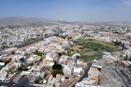 an aerial view of a city with buildings at Awaliv Hotel in Taif
