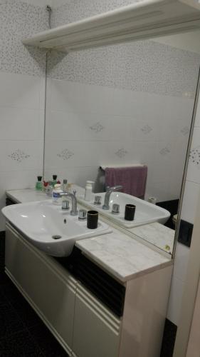a bathroom with a sink and a mirror at La Villetta di Sabrina in Marsala