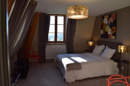 Ліжко або ліжка в номері Hotel La Croix De Vernuche