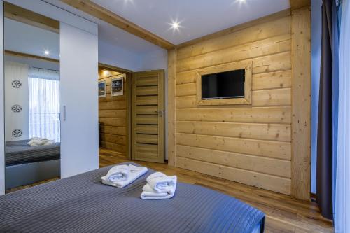 Posteľ alebo postele v izbe v ubytovaní Apartament Tatrzanski Raj