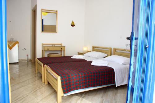 Katil atau katil-katil dalam bilik di Angelos Rooms