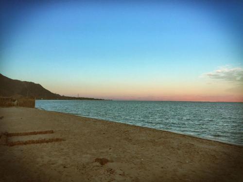a view of the ocean with a sandy beach at SakraTah Camp - eco friendly in Taba