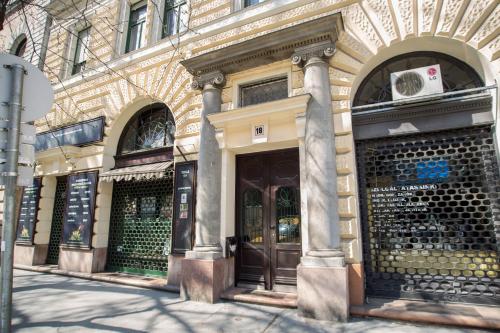 a building with two doors on a street at Broadway Residence in Budapest