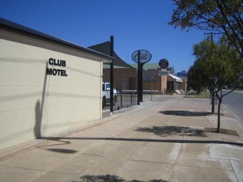 a building with a club motel sign on the side of it at Balranald Club Motel in Balranald