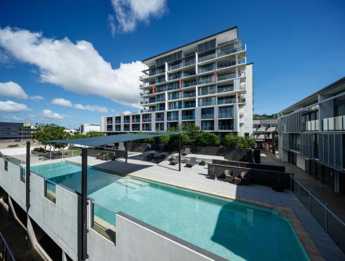a swimming pool on the roof of a building at Central Islington Apartments in Townsville