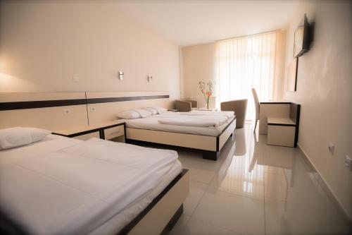 Postel nebo postele na pokoji v ubytování Hotel Zelengora