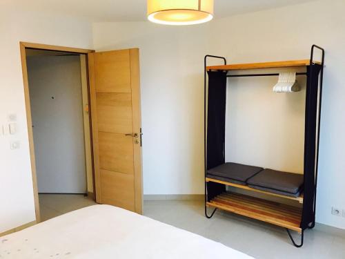 a bedroom with a bunk bed and a closet at Villa Picon in Annecy