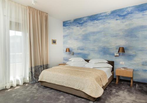 Postel nebo postele na pokoji v ubytování Boban Luxury Suites