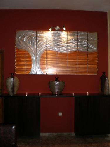 a window in a room with two vases on a table at Vallian Village Hotel in Paradeísion