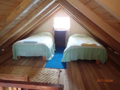 Postel nebo postele na pokoji v ubytování Hosteria Rose Cottage