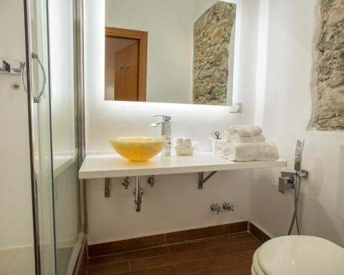 a bathroom with a sink and a mirror at Hotel Marina in Monterosso al Mare