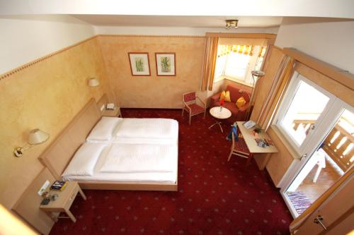 Una cama o camas en una habitación de Hotel Steiger