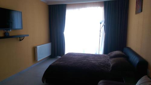 Ένα ή περισσότερα κρεβάτια σε δωμάτιο στο Valley Bakuriani, apartment 303