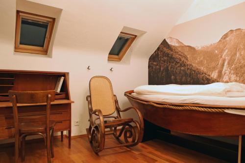 a bedroom with a bed and a desk and a chair at Hostel die Wohngemeinschaft in Cologne