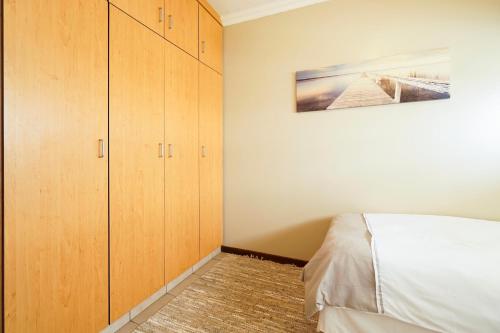 Ένα ή περισσότερα κρεβάτια σε δωμάτιο στο Beachfront Apartments @ Amanzimtoti