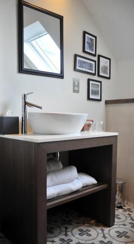 a bathroom with a sink and a mirror at Marmalade in Portree