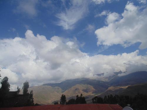 a view of a mountain range with a cloudy sky at Torpedo Hotel in Lalībela