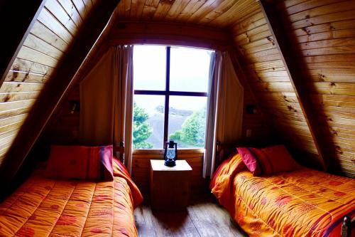 Cama o camas de una habitación en Cabañas & Piscina Rucamalen