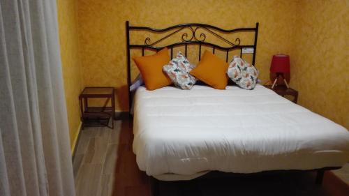 Ένα ή περισσότερα κρεβάτια σε δωμάτιο στο Hostal La Aldaba