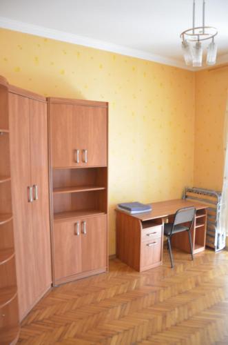 an empty office with a desk and a chair at Bon Apart Naberegna in Mykolaiv
