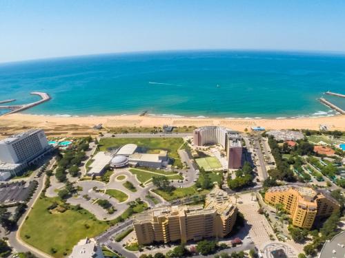 an aerial view of a resort and the beach at Dom Pedro Portobelo in Vilamoura