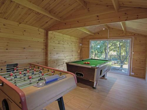 a log cabin with a pool table and a pool table at Modern Villa with Private Swimming Pool in L denon in Lédenon