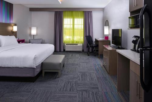 a hotel room with a bed and a desk at Holiday Inn Express & Suites Shippensburg by IHG in Shippensburg