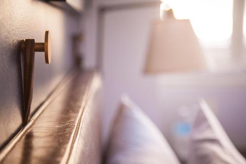 a close up of a wooden bench in a room at U Hotel Fifth Avenue, Empire State Building in New York