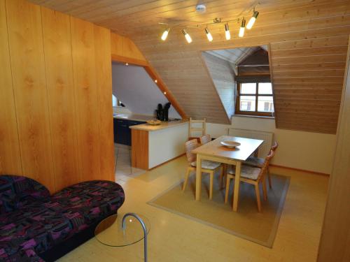 a kitchen and dining room with a table in a room at Modern Holiday Home in Prunn near Lake in Riedenburg